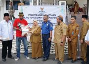 Ratusan Petugas Sampah-Tenaga PHL Damkarmat Terima Bantuan dari Baznas Palu